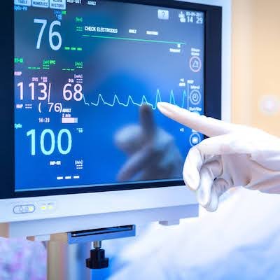 Female surgeon using monitor Banner
